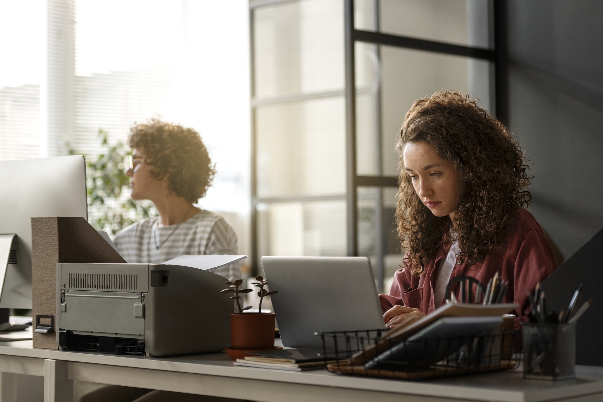 two women at a desk working